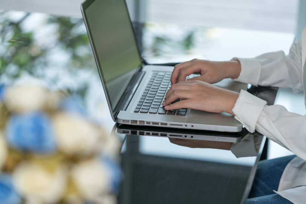 closeup-woman-hand-using-computer-laptop-using-online-connect-technology-business-education