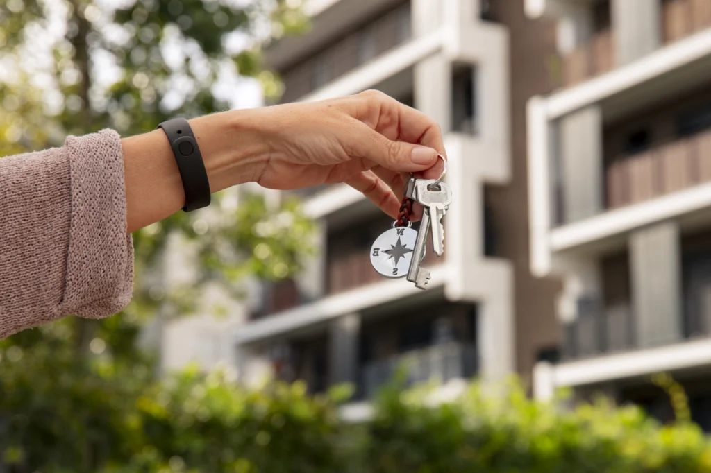 hand-holding-keys-outdoors