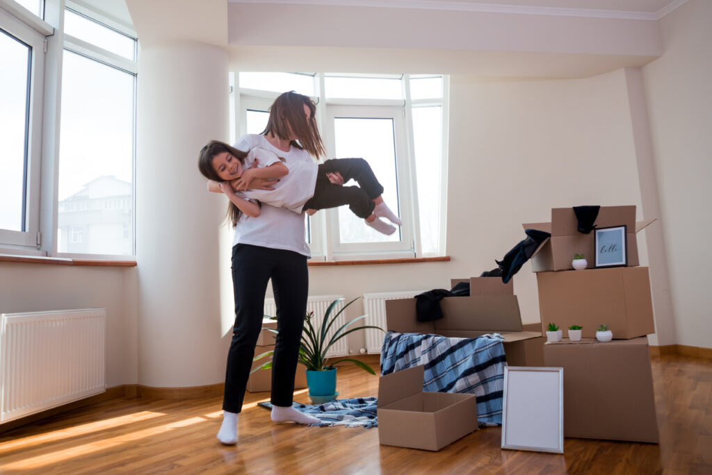 mom-daughter-having-fun-because-moving-ne-apartment-copyspace