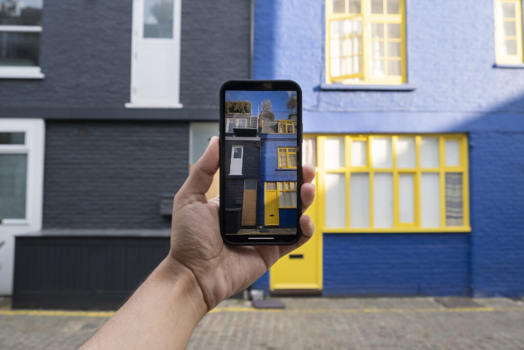 hand-taking-photos-with-smartphone-city