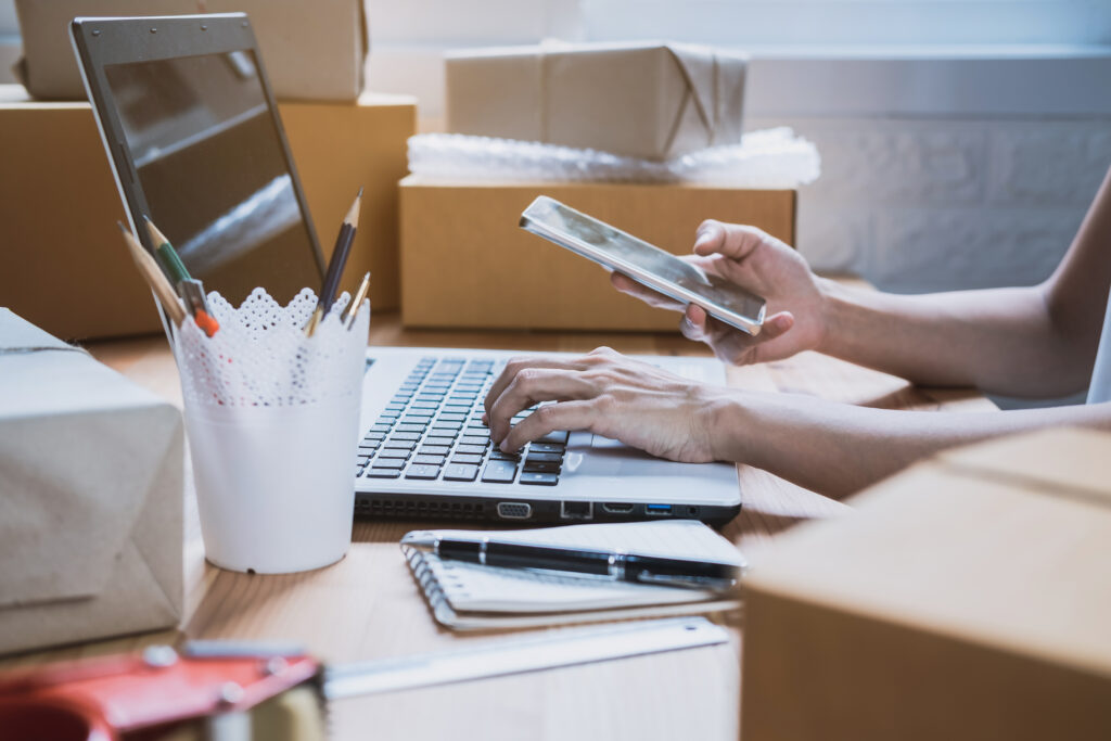 Young startup small business entrepreneur woman working with smart phone at home, Online business and delivery concept