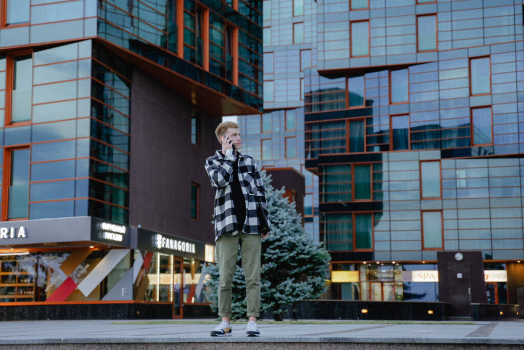 modern young businessman agreeing on an interview against the background of an office glass building