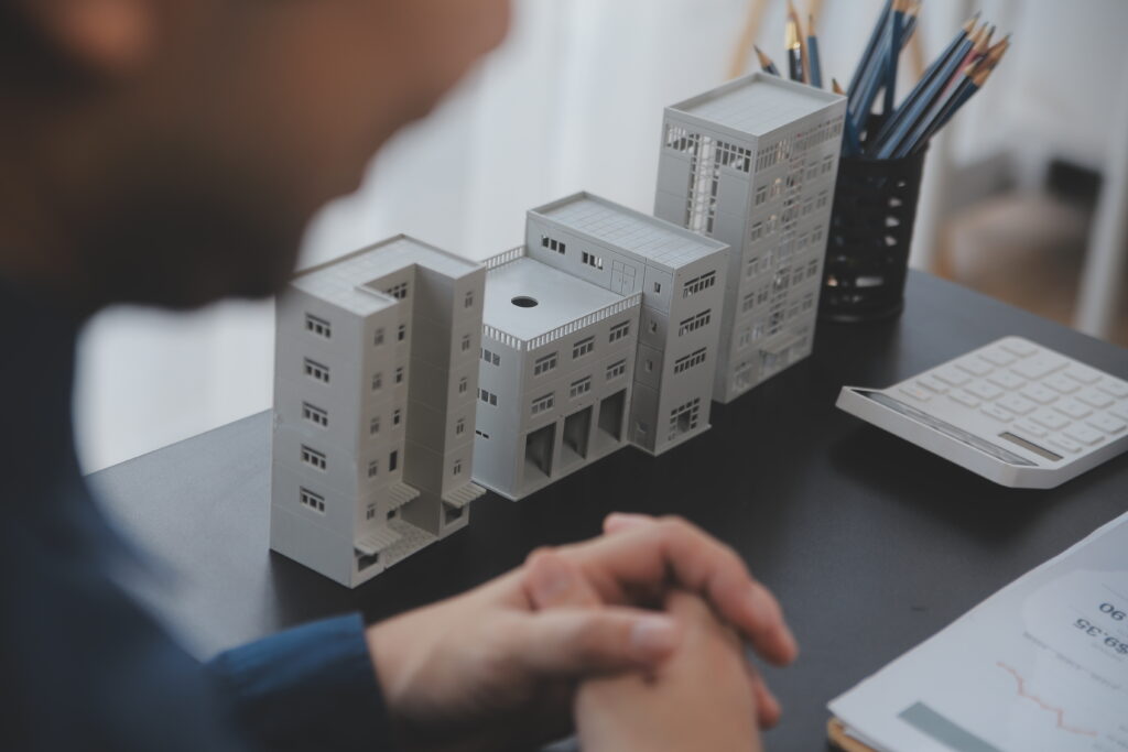 Real estate agent and Sales manager team analysis pricing of rental lease contract of sale purchase agreement, concerning mortgage loan offer for and house insurance.